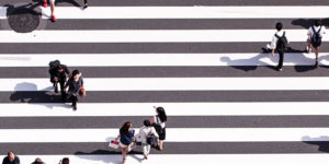 people crossing at a newly painted pedestrian lane