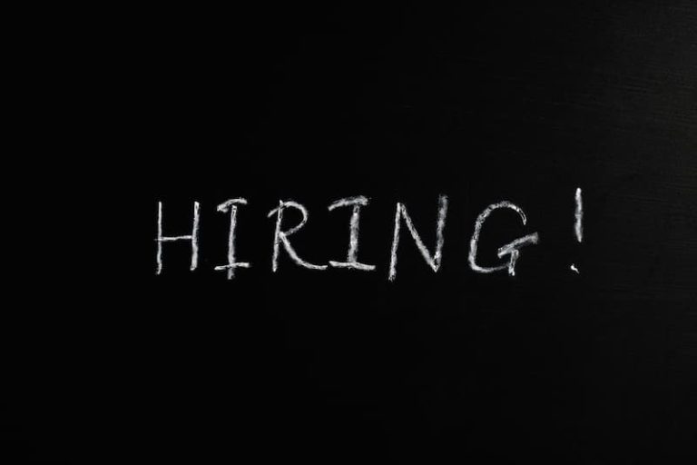 "Hiring" written on a black board Feature Image For: 6 Best Job Ad Examples to Try in 2022