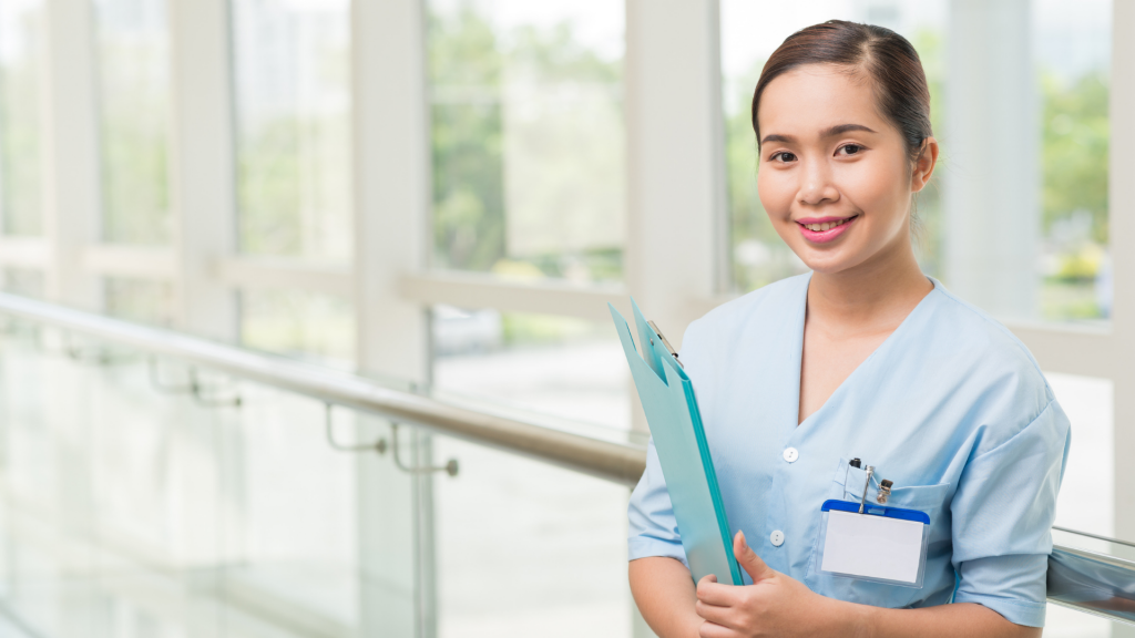 female nurse holding a folder with name tag on her pocket