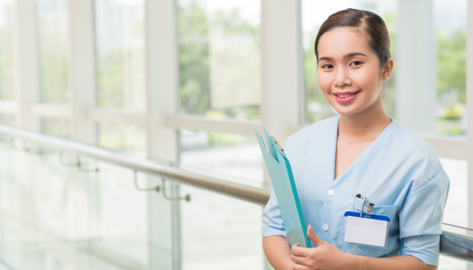female nurse holding a folder with name tag on her pocket